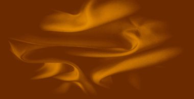 Bulanık turuncu kumaş kıvrımları, hafif ışık değişimleriyle maddenin yumuşak dokusunu geliştiren bir akış etkisi yaratır. Yumuşak eğriler bileşime derinlik ve sıcaklık ekler.