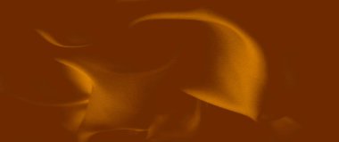 Yumuşak, akışkan kıvrımlı, pürüzsüz turuncu kumaş ve karmaşık bir doku. Sıcak, altın rengi maddenin akıcılığını arttırır, kumaşa derinlik ve zenginlik katar..