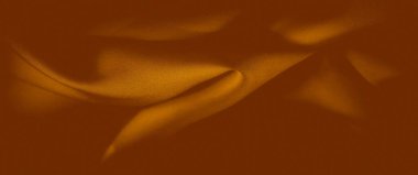 Görünür ince dokular ve karmaşık kıvrımlarla hareketli turuncu dokuların bulanık görüntüsü. Kumaşın sıcak tonu ve dinamik akışı görsel olarak rahatlatıcı bir etki yaratır.,