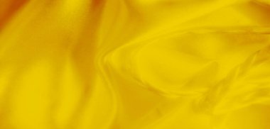 Narin örülmüş dokuları olan sarı bir kumaşın bulanıklığı. Pürüzsüz yüzey ve canlı sarı renk yaratıcı projeler için mükemmel zarif ve soyut bir görsel oluşturur..