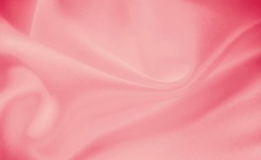 Birbirine dolanmış yumuşak pembe kumaş kıvrımları zarif ve lüks bir doku oluşturur. Yumuşak kumaş ve ince vurgular kumaşın zarafetini vurgular..
