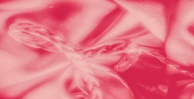 Pembe kumaşın bulanık görüntüsü ve karışık örgülü detaylar. Saten benzeri doku ve akışkan hatlar zarif ve lüks bir his yaratıyor. Tekstil tasarımı için mükemmel..