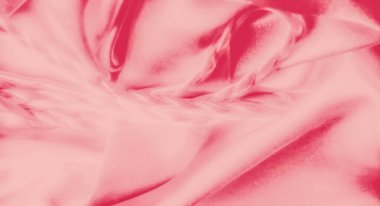 Pembe kumaşın örülmüş dokusu ile bulanık görüntüsü sofistike bir görsel etki yaratıyor. Saten benzeri maddenin pürüzsüz kıvrımları zarif ve lüks çekiciliğini artırıyor..