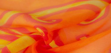 Bulanık turuncu ve sarı soyut kumaş, zengin girdap desenleri var. Canlı renkler ve yumuşak, akışkan doku bu kumaşı parlak bir vizuyla sıcak, dinamik ve enerjik tasarımlar için mükemmel kılıyor.