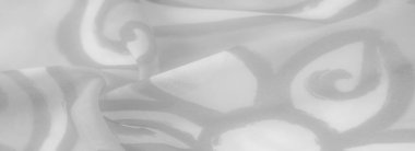 Karmaşık soyut desenli bulanık gri kumaş. Yumuşak dokusu ve nazik kıvrımları modern, sofistike bir estetik yaratıyor. Ev dekorasyonu veya moda tekstili için uygun..