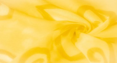 Yumuşak kıvrımlı bulanık sarı kumaş ve kıvrımlı soyut desenler. Tasarımdaki dinamik ışık ve koyu gölgeler kumaşa derinlik ve hareket ekler ve zarif bir şekil verir.