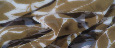 Beyaz soyut tasarımlar içeren kahverengi kumaş bulanıklığı. Yumuşak, akıcı doku ve dünyadan esinlenilmiş desen tasarım projeleri için modern ama doğal bir görünüm yaratıyor..