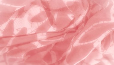 Soyut ve doğadan esinlenilmiş pembe bir kumaş. Kumaşın yarı şeffaflığı ve pürüzsüz kıvrımları soyut sanat ve arka plan için mükemmel bir ışık ve yumuşak bir görünüm yaratıyor.