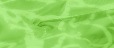 Bulanık yeşil soyut kumaş deseni yumuşak kıvrımlar ve ince gölgeler dinamik bir akış etkisi yaratıyor. Kumaş dokusu hareket ve derinlik hissi veriyor.