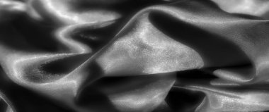 Derin kıvrımları ve yumuşak dokusu olan saten kumaştan siyah bir Blur. Işık parlak maddeyi yansıtıyor, gölgeler ve gölgeler arasında zarif bir etkileşim yaratıyor, lüks hissi arttırıyor.