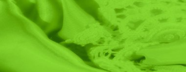 Yumuşak kıvrımlı yüksek kontrastlı yeşil dantel kumaş bulanıklığı. Zarif tasarım hem pürüzsüz kumaşı hem de ince nakışı gözler önüne seriyor, lüks bir doku sağlıyor..