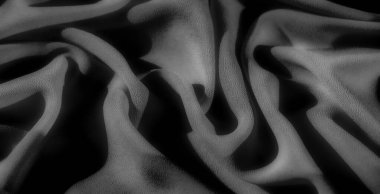 Siyah, Görüntü, yumuşak dokuya derinlik katlayarak yumuşak ve zarif bir tekstil görüntüsü oluşturan yumuşak kıvrımlı ve zengin gölgeli ince gri tonlu bir tasarım yakalar..