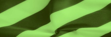 Pürüzsüz kıvrımlar halinde akan yeşil ve koyu renkli çizgiler dinamik kontrast ve madde boyunca nazik dalgalarla dokulu bir kumaş görünümü yaratıyor..