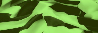 Siyah dalga benzeri çizgilerle nazikçe katlanmış yeşil kumaş bulanıklığı renk ve dokuların uyumlu bir karışımını oluşturuyor. Yumuşak kıvrımlar rahat ve zarif bir stil sağlar.