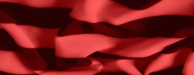 Kırmızı kumaşın karmaşıklığını bulanıklaştırır ve siyah desenler yumuşak kıvrımlar oluşturarak büyüleyici bir görsel derinlik oluşturur. Arkaplan için ideal, sanatsal bir renk ve doku dengesi sergiler.