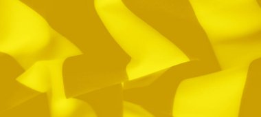 Bulanık - Yumuşak kıvrımlı ve gölgeli yumuşak sarı kumaş. Resim sıcaklığı somutlaştırır ve herhangi bir tasarım projesine derinlik ekler.