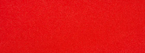 Pürüzsüz, yumuşak kıvrımlı ve hafif parıltılı parlak kırmızı kumaş. Koyu kırmızı renk, üst düzey moda veya tasarım projeleri için ideal materyalin lüks ve zarif doğasını vurgular..