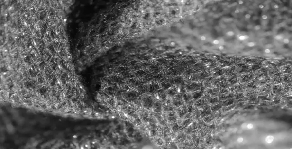 Pırıl pırıl, parlak siyah kumaşlar ve ince kıvrımlar. Karmaşık ışık yansımaları yüksek moda veya soyut tekstil tasarımları için uygun dinamik ve lüks bir görünüm yaratır..