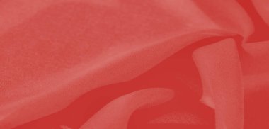 Koyu kırmızı kumaştan bulanık yumuşak kıvrımlar zarif röflelerle lüks bir doku yaratır. Kumaşa gözü büyüleyen zengin, akışkan bir görünüm verir..