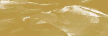 Yumuşak, ışık yakalayan kıvrımlı ve katmanlı çiçek desenli zarif sarı kumaş bulanıklığı. Yumuşak dokusu ve şeffaflığı narin bir cazibe sunuyor, ışığı ve dokuyu uyumlu bir şekilde harmanlıyor..