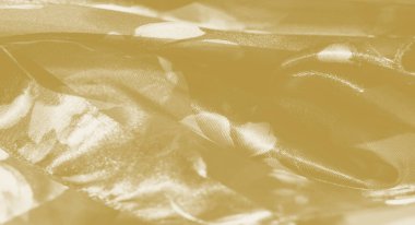 Yumuşak, ışık yakalayan kıvrımlı ve katmanlı çiçek desenli zarif sarı kumaş bulanıklığı. Yumuşak dokusu ve şeffaflığı narin bir cazibe sunuyor, ışığı ve dokuyu uyumlu bir şekilde harmanlıyor..