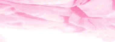 Yumuşak pembe kumaştan ince parlak ışıklar, zarif kıvrımlar ve parlak, ruhani bir görünüş yaratıyor zarif ve lüks tekstil arkaplanları için mükemmel..