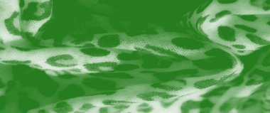 Görüntü bu yeşil tekstil soyut desenler doğal dokuları çağrıştırıyor. Yumuşak, pürüzsüz kumaş, canlı renk ve organik şekillerin eşsiz bir karışımını sunar..