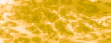 Bulanık, leopar benzeri lekeleri olan sıcak sarı kumaş desenli bir yüzeye saçılmış. Nazik kıvrımlar ve ışık yumuşak, davetkar bir ortam yaratıyor, arka plan için mükemmel..