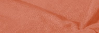 Bulanık - Yumuşak desenli buruşuk turuncu kumaş ve hassas röfleler, yaratıcı tasarımlarda ve sıcaklığın ve dokunun gerekli olduğu arka planlarda kullanılmak için idealdir.