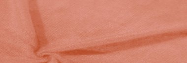 Bu turuncu kumaş pürüzsüz kıvrımları ve dokumasıyla kumaşın yumuşaklığını ve sıcaklığını ön plana çıkarıyor. Işık, yüzeyinde rahat ve dokunulabilir bir boyut ekliyor..