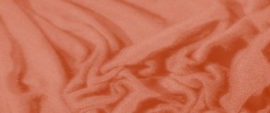 Bulanık - Pürüzsüz, akışkan kıvrımlı turuncu kumaş ve narin doku, sıcak ve samimi bir estetik sunuyor, arka plan kullanımı veya tekstil tasarımları için uygun.