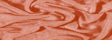 Görüntü. Turuncu kumaşta yumuşak kıvrımlar ince bir parıltıyla zengin bir doku oluşturur. Karmaşık katman ve pürüzsüz yüzey zarif tasarım temaları için ideal hale getiriyor..