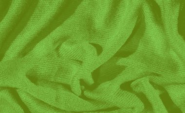 Yumuşak kıvrımlı, katmanlı, dokulu bir yüzey sunan zengin yeşil bir kumaşın bulanıklığı. Konforlu malzeme ve parlak renk görsel olarak çekici bir arkaplan oluşturur, tasarım projeleri için mükemmeldir..