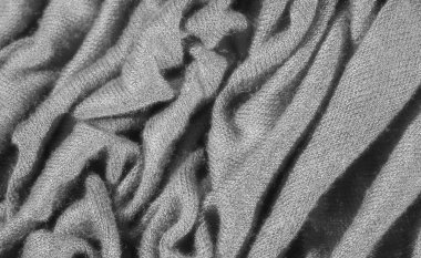 Örgü desenli ve katmanlı bulanık siyah kumaş. Zengin doku ve gölgeler rahat, sofistike bir zemin oluşturur. Minimalist ve modern tasarımlar için mükemmeldir..