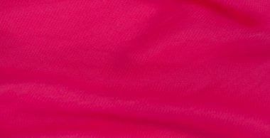 Yumuşak, pürüzsüz bir dokusu ve derinlik yaratan doğal kıvrımları olan canlı pembe kumaş bulanıklığı. Zengin renkler ve dalgalı kumaşlar lüks hissi katar, moda ve tekstil görselleri için mükemmeldir.