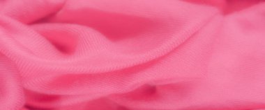 Karmaşık kıvrımları olan zengin pembe tekstil bulanıklığı dinamik ve katmanlı bir yüzey oluşturuyor. Pürüzsüz kumaş sıcak pembe bir renk yayar, yakın çekim ince dokuya sahiptir..