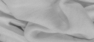 Yumuşak katlanmış beyaz kumaş bulanıklığı ve pürüzsüz, akıcı bir dokusu var. Sakin, tek renkli görünüm, arka plan ya da tekstil tasarım uygulamaları için idealdir..