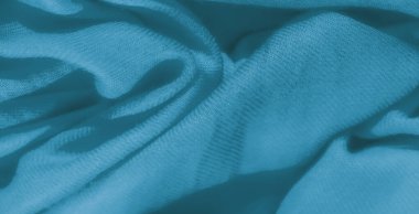 Bulanık tanım: Yumuşak mavi kumaşın narin kıvrımları ve yumuşak bir dokusu var, sakinlik ve hareket hissi yaratıyor. Dalgalı desenler kumaşın tasarımına rahatlatıcı, sanatsal bir dokunuş ekler.