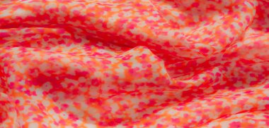 Turuncu, pembe ve açık renkli büyüleyici bir karışımı olan bulanık kumaş. Yumuşak ve şeffaf dokusu hayal gibi, romantik bir etki yaratıyor. Moda ve dekor için ideal..
