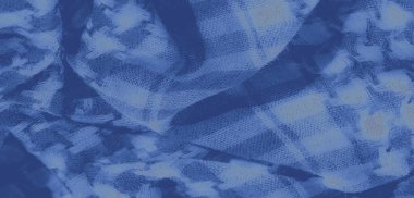 Bulanık, karmaşık desenleri ve yumuşak, dokulu bir yüzeyi olan mavi bir kumaş. Hassas katlar ve dokuma tasarım derinlik ekler, soyut ve tekstil arka planlar için mükemmeldir..