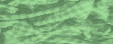 Houndstooth desenli yeşil kumaş bulanıklığı. Malzemenin ince kıvrımları var, derinlik ve hareket yaratıyor, hassas gölgeler ve röfle oyunlarıyla..