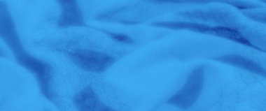 Karmaşık kıvrımları ve dokuları olan mavi kumaş bulanıklığı lüks ve huzurlu görünümünü artırıyor. Yumuşak mavi tonu ve narin tasarımı onu sakin arka planlar için mükemmel kılıyor..