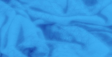 Pürüzsüz, akışkan kıvrımlı mavi kumaş. Uyumlu ve yumuşak bir dokuyu temsil ediyor. Yumuşak mavi tonlar ve ince dokular arka planda çok yönlü olmasını sağlar.,