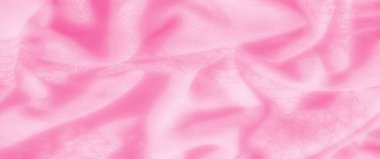 Yumuşak ve pürüzsüz bir doku oluşturan yumuşak kıvrımlı pembe kumaş bulanıklığı. Pastel renk, maddenin genel olarak nazik ve sakin estetiğine eklenir.