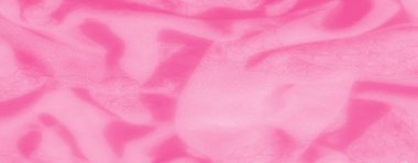 Hassas kıvrımlı bulanık pembe kumaş akışkan bir doku yaratır. Pürüzsüz yüzey ve ince ışık yansımaları, arka planlar için mükemmel olan nazik görünümünü geliştirir..