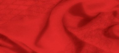 Sıcak, pürüzsüz bir dokusu ve yumuşak kıvrımları olan bulanık kırmızı kumaş zarif ve lüks bir his yaratıyor. Gölgeler bu tekstilin zenginliğini ve derinliğini arttırır..