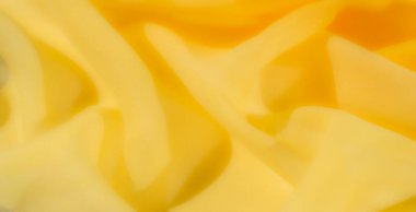 Bulanık - Yumuşak kıvrımlı kıvrımlı, sıcaklığı ve yumuşaklığı ileten güzel kıvrımlı sarı bir kumaş. Hassas dokusu ve canlı sarı tonu soyut arka planlar için mükemmel hale getiriyor.