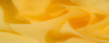 Bulanık - Yumuşak kıvrımlı kıvrımlı, sıcaklığı ve yumuşaklığı ileten güzel kıvrımlı sarı bir kumaş. Hassas dokusu ve canlı sarı tonu soyut arka planlar için mükemmel hale getiriyor.