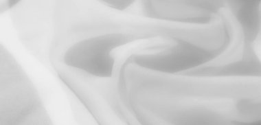 Bulanık beyaz kumaş yumuşakça kıvrılır, sakin ve lüks bir his yaratacak ince kıvrımlar oluşturur. Hafif ve temiz dokusu onu rafine, minimalist tasarım kavramları için mükemmel kılıyor..