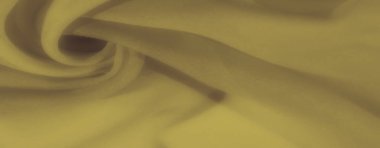 Yumuşak, akışkan kıvrımlı sarı kumaşlar. Sıcak, davetkar bir doku yaratıyor. Tekstil tasarımları, rahat arka planlar ve dekor projeleri için mükemmel..